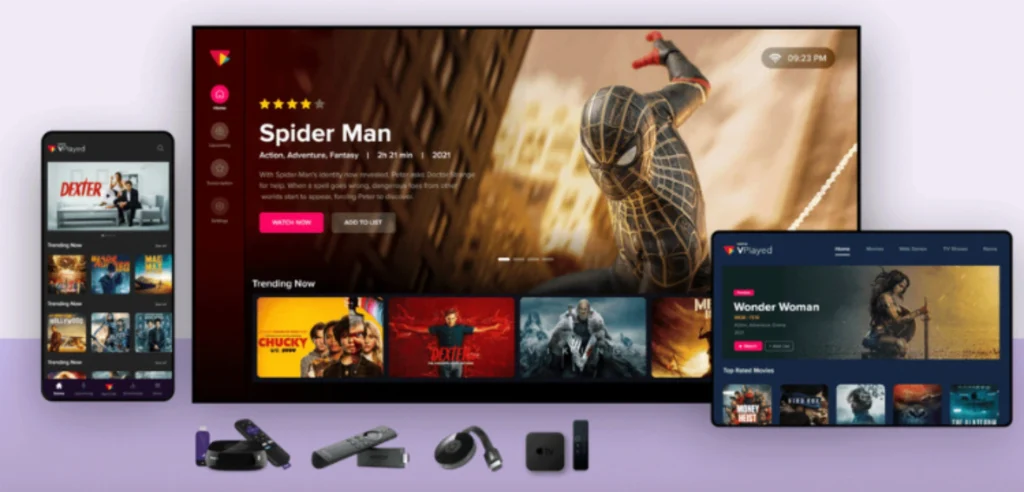 "A promotional image showing the VPlayed IPTV streaming platform across different devices. The main focus is a TV screen displaying the movie 'Spider Man,' with the interface showing options like 'Watch Now' and 'Add to List.' Below the TV screen, there is a smartphone displaying the series 'Dexter' and several trending movies. Additionally, there are streaming devices such as a Roku, Apple TV, and remote controls placed at the bottom of the image.